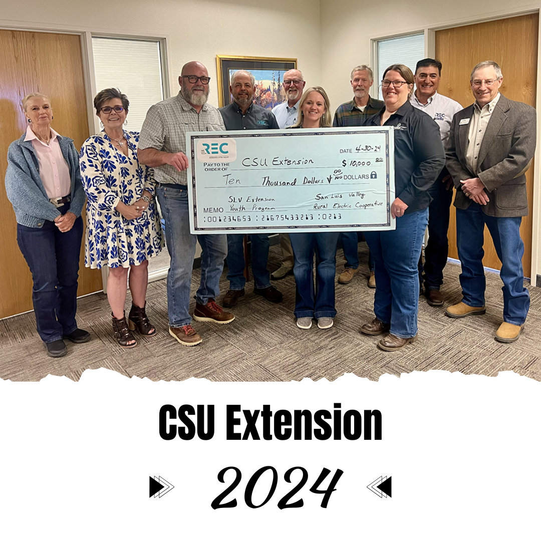 CSU Extension employees and REC board members with $10,000 check